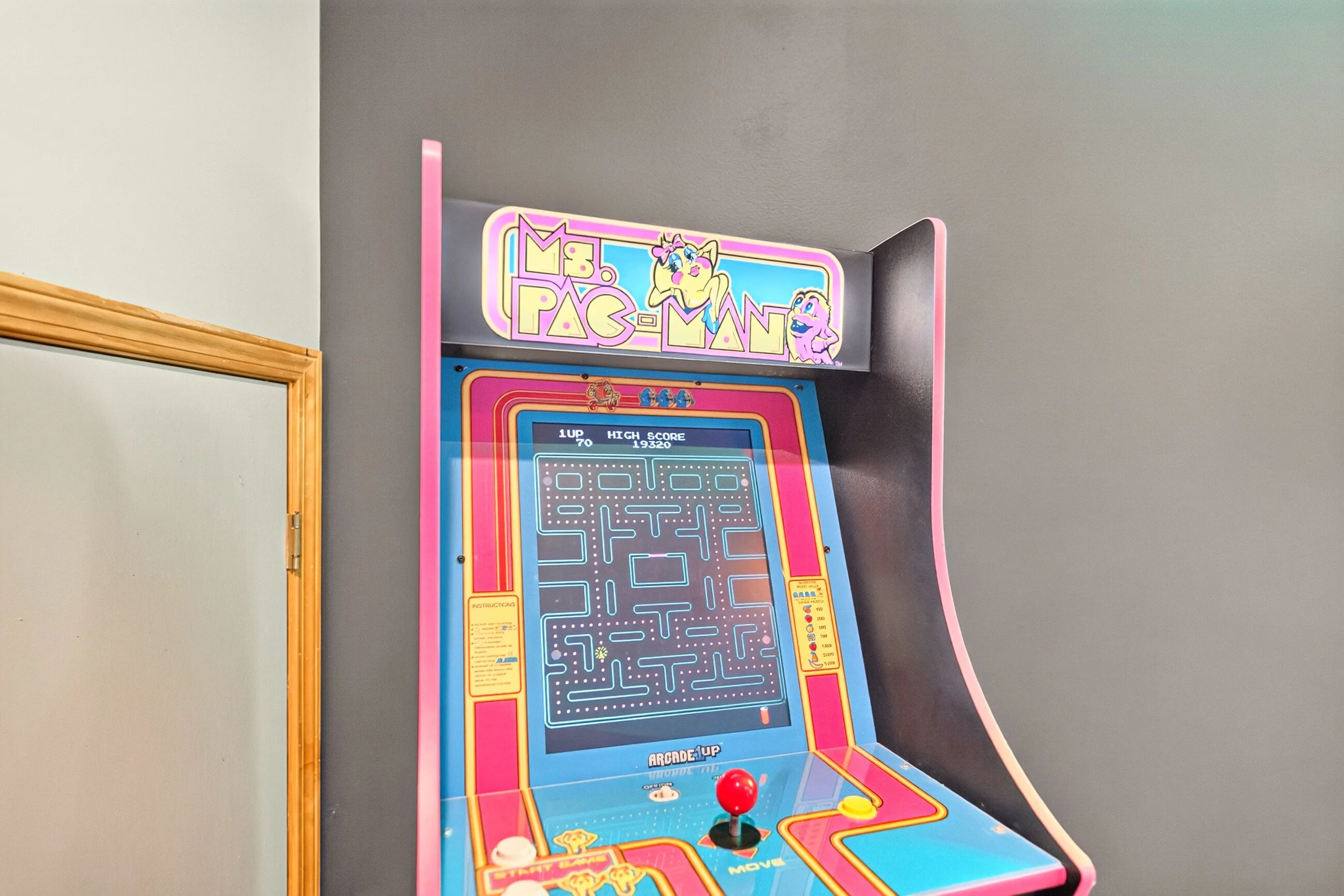 Ms Pac-Man arcade cabinet in the game room