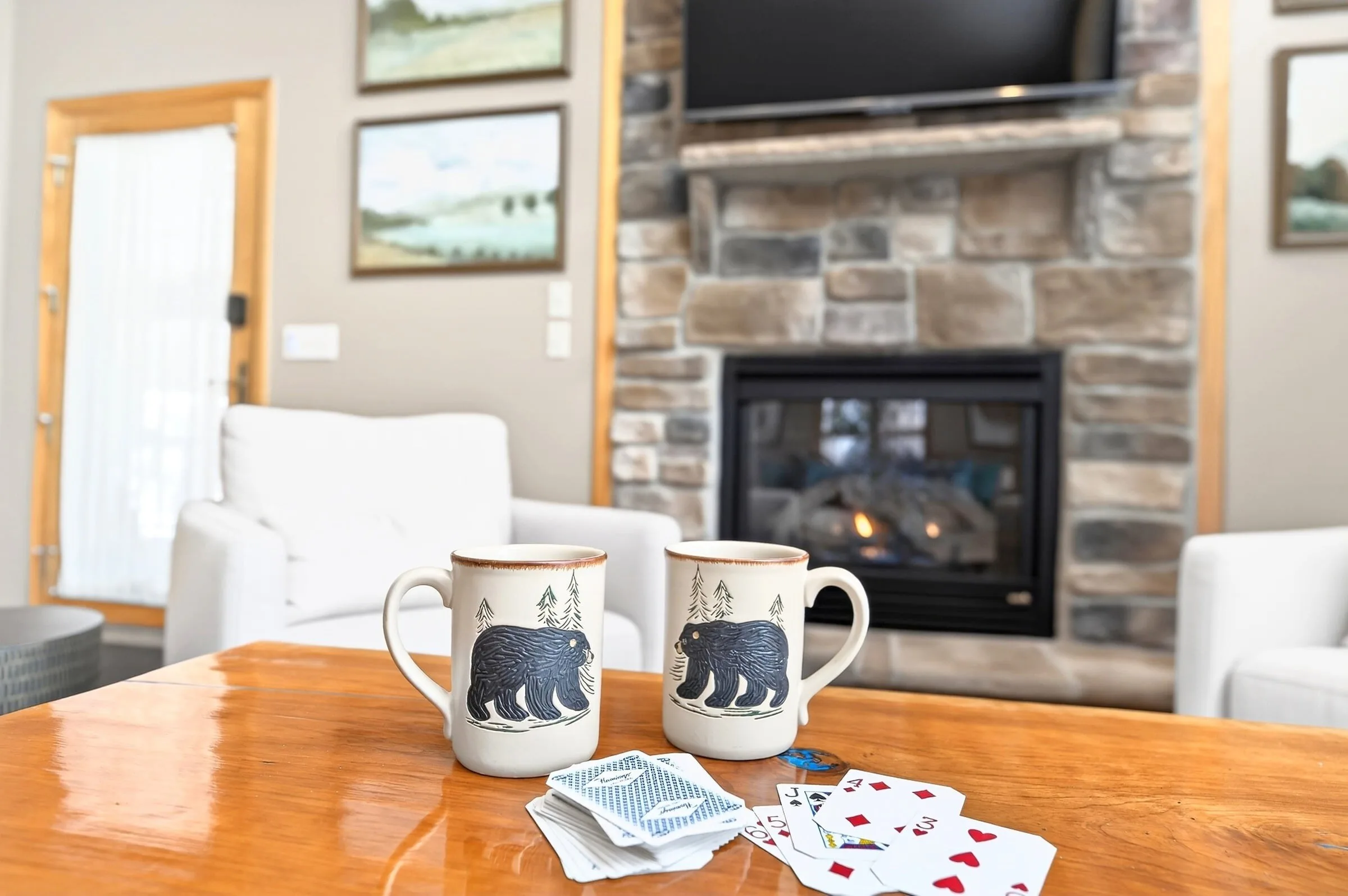 Coffee by the gas fireplace with a deck of cards on the table