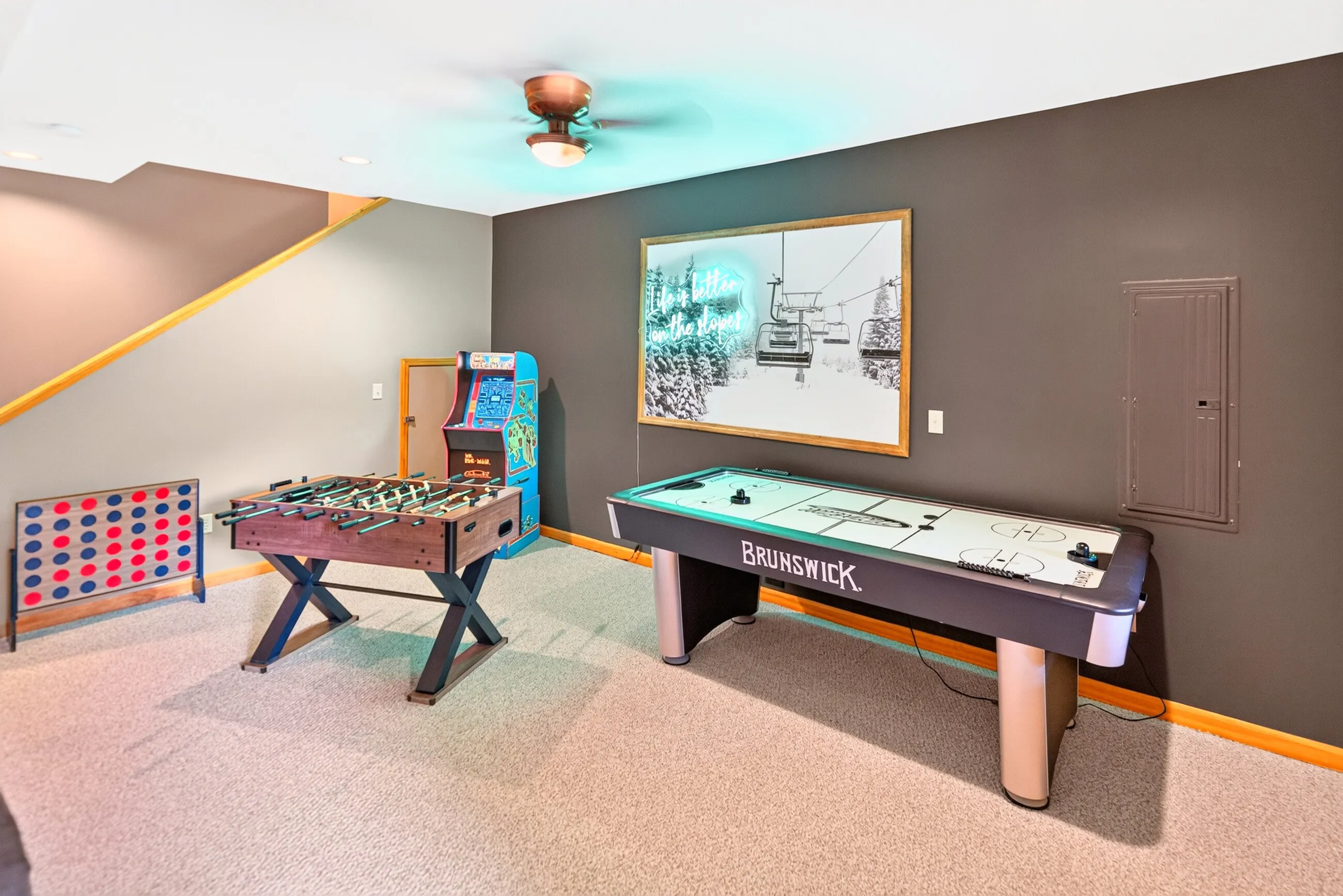 Game room with foosball, air hockey and giant Connect Four