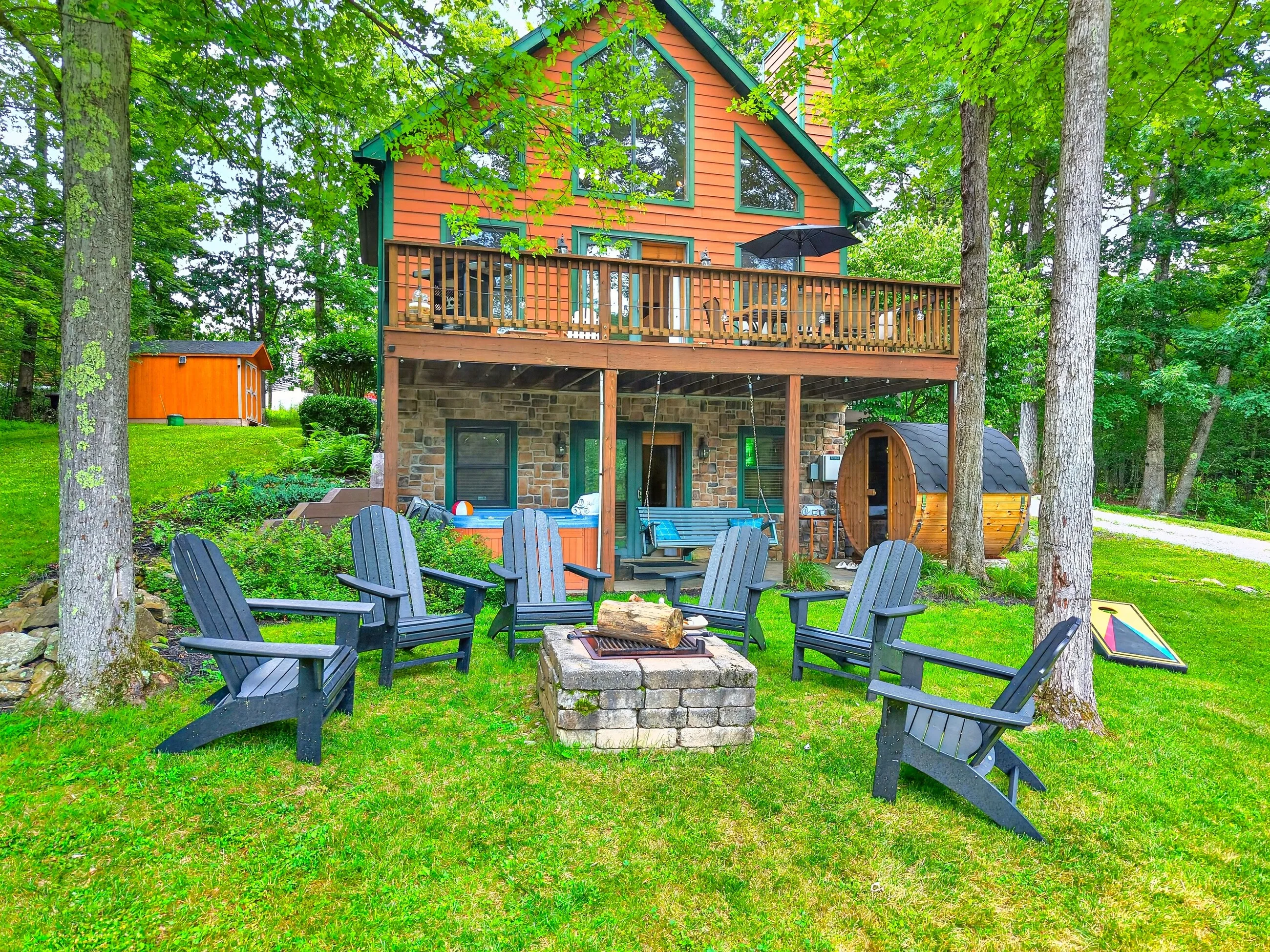 Northlake Summit in summer, fire pit and Adirondack chairs on the lawn